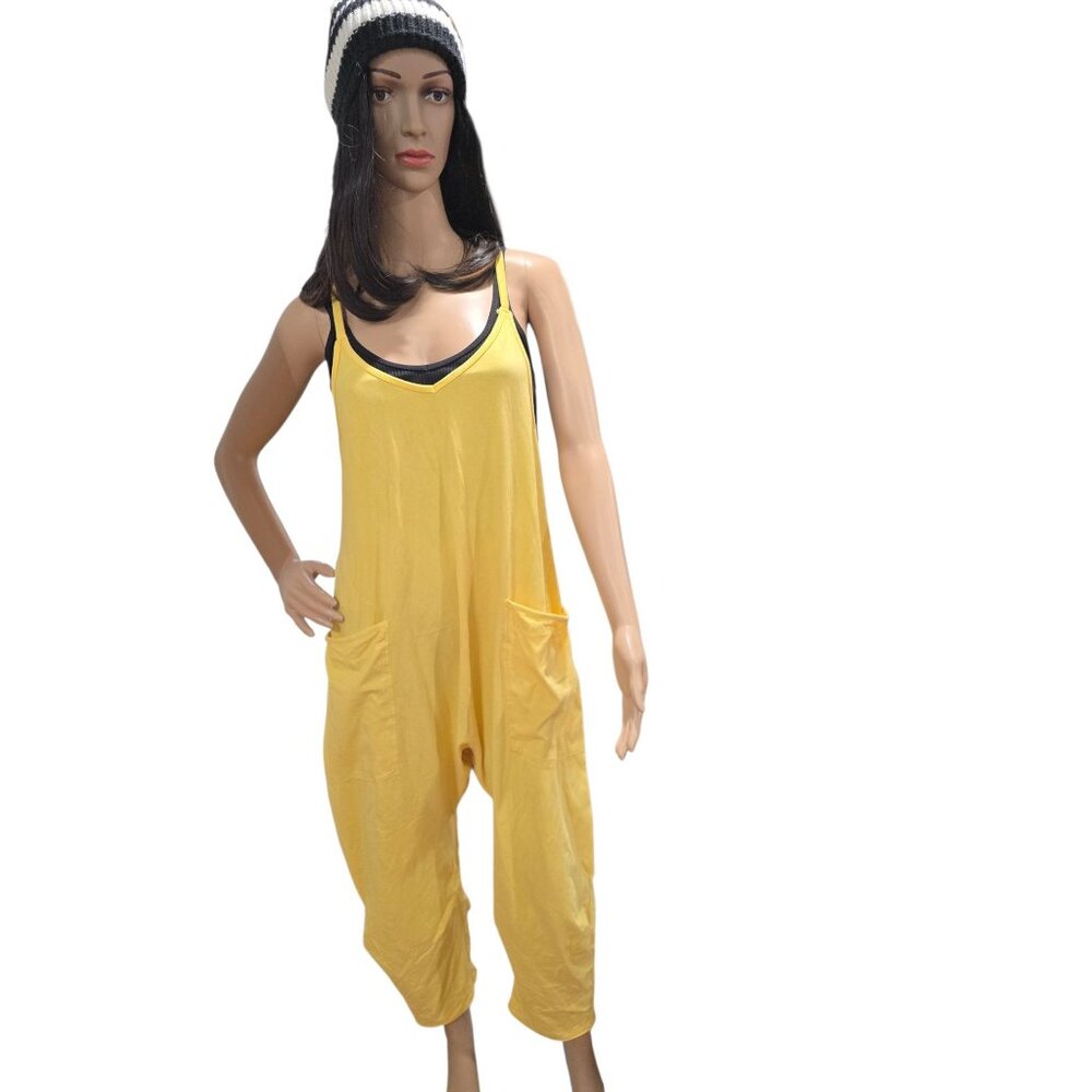 Free people movement Hot shot jumpsuit in a yellow color size XS